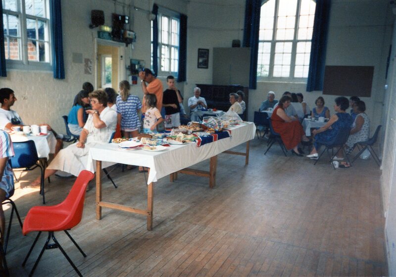 people eating tea in villagfe hall